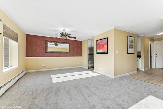 spare room with carpet floors, baseboard heating, ornamental molding, baseboards, and wallpapered walls