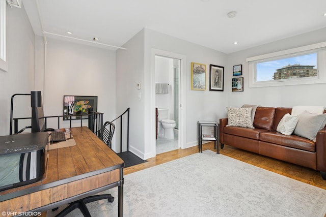 home office with recessed lighting, baseboards, and wood finished floors