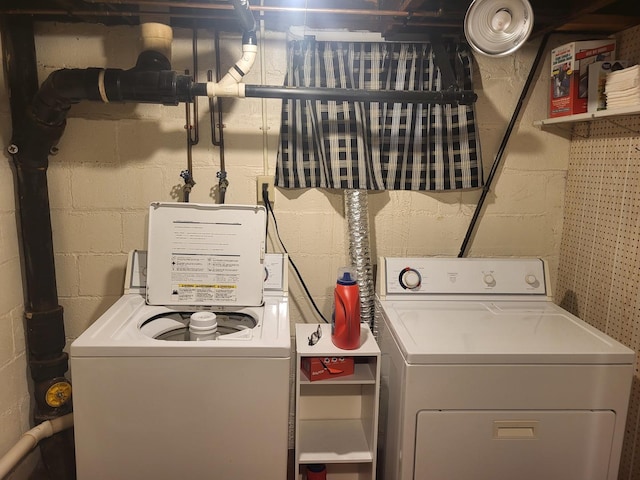 clothes washing area with laundry area and separate washer and dryer