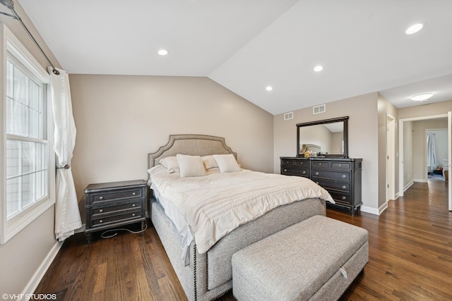 bedroom featuring vaulted ceiling, visible vents, and baseboards