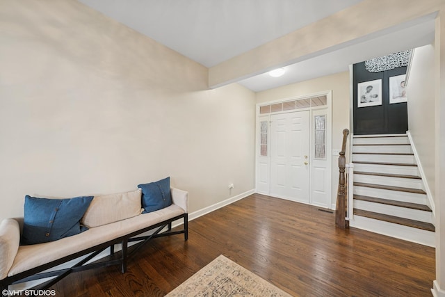 foyer entrance featuring wood-type flooring, stairs, and baseboards