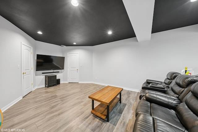 living room featuring light wood-style floors, recessed lighting, and baseboards