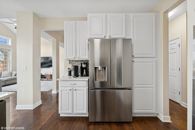 kitchen featuring light countertops, dark wood-style flooring, white cabinets, and stainless steel fridge with ice dispenser