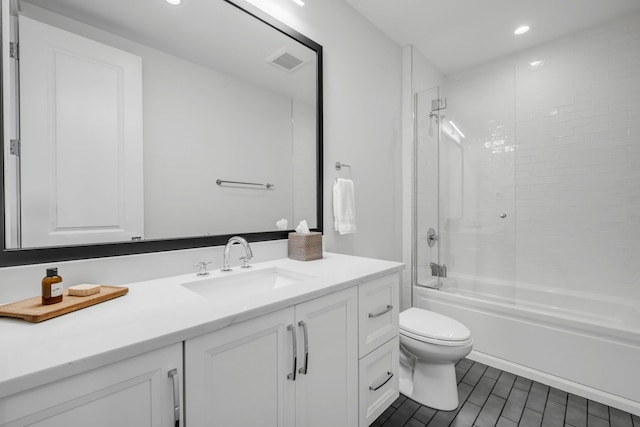 bathroom with bathing tub / shower combination, visible vents, toilet, vanity, and wood finished floors