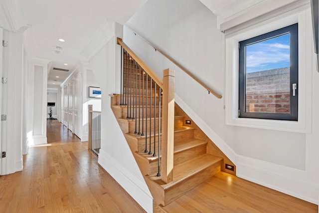 stairs featuring recessed lighting, wood finished floors, and baseboards