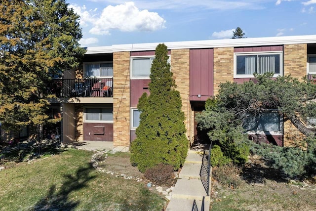 view of front of house featuring brick siding