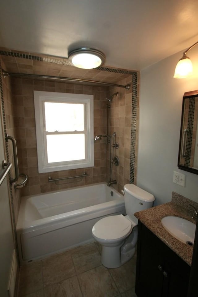 bathroom with toilet, tile patterned flooring, shower / tub combination, and vanity