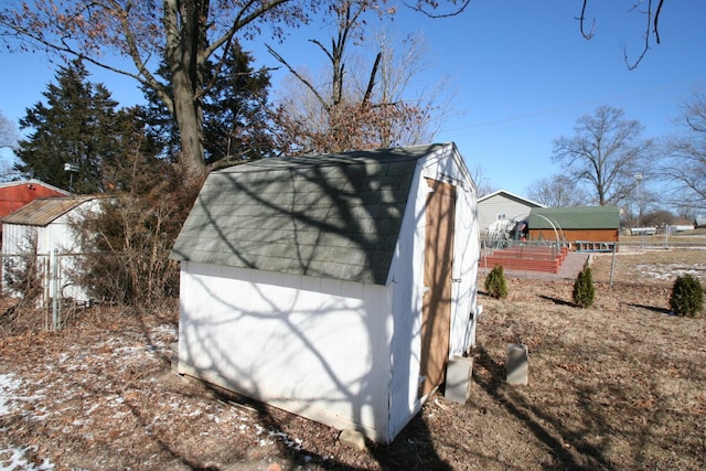 view of shed with fence