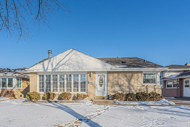 view of front of home with brick siding