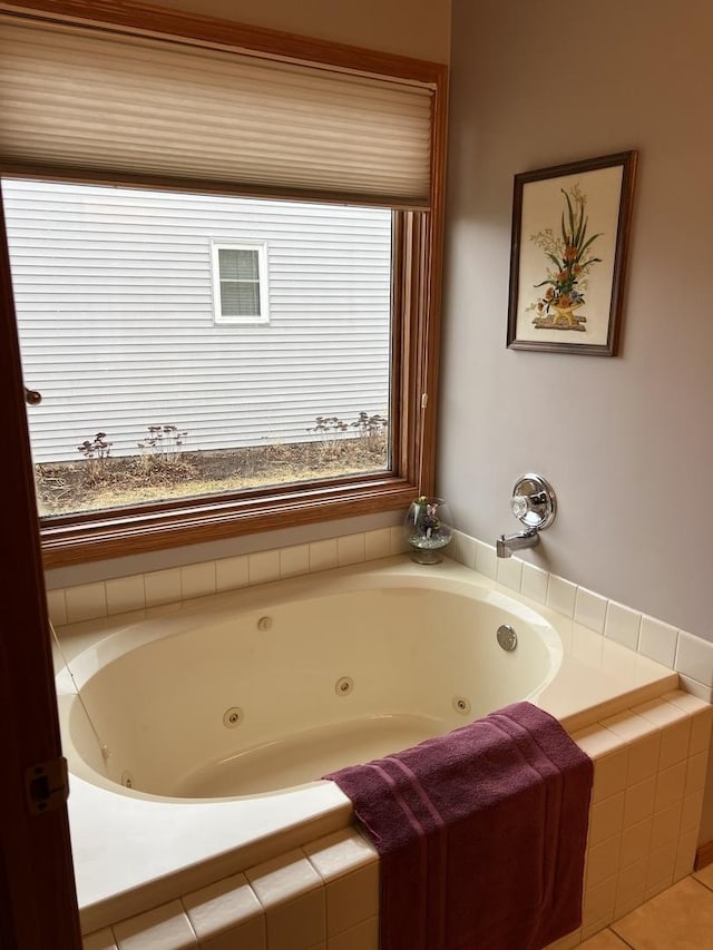 full bathroom with a whirlpool tub