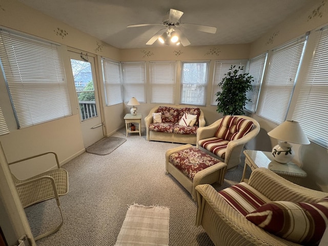 sunroom featuring a ceiling fan