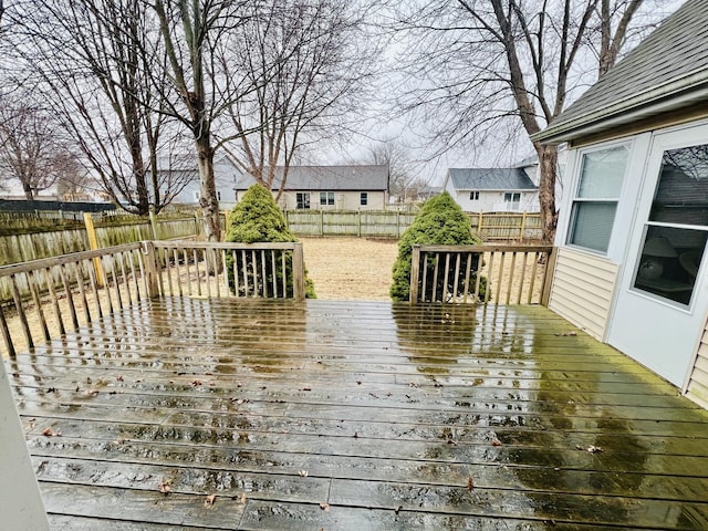 deck with a fenced backyard