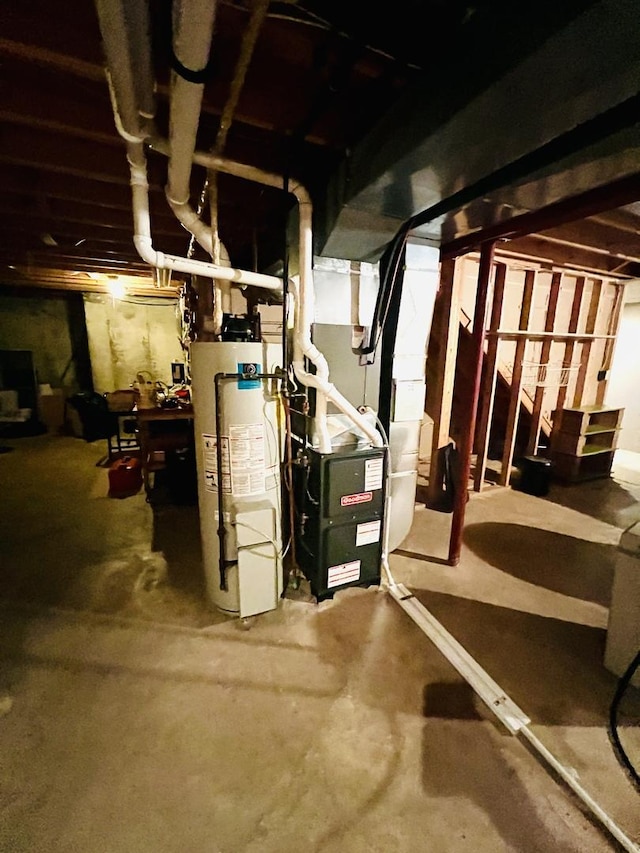 unfinished basement featuring gas water heater and heating unit