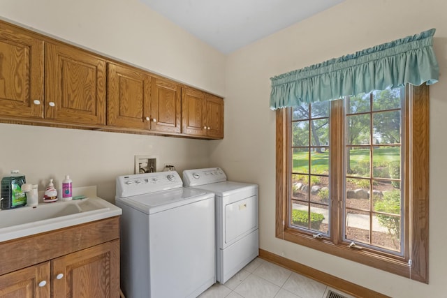 9 Forest Ln, South Barrington, IL 60010 - clothes washing area featuring cabinet space, light tile patterned floors, baseboards, washer and clothes dryer, and a sink