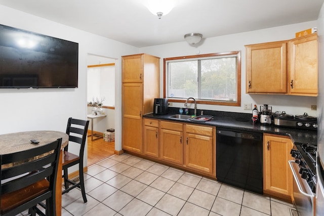 kitchen with black dishwasher, light tile patterned floors, dark countertops, stainless steel gas stove, and a sink