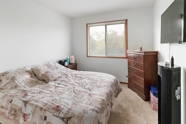 bedroom with light colored carpet