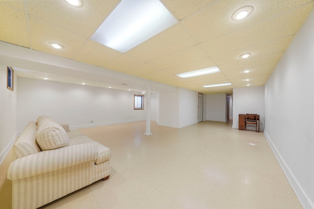 interior space with a paneled ceiling, baseboards, and recessed lighting