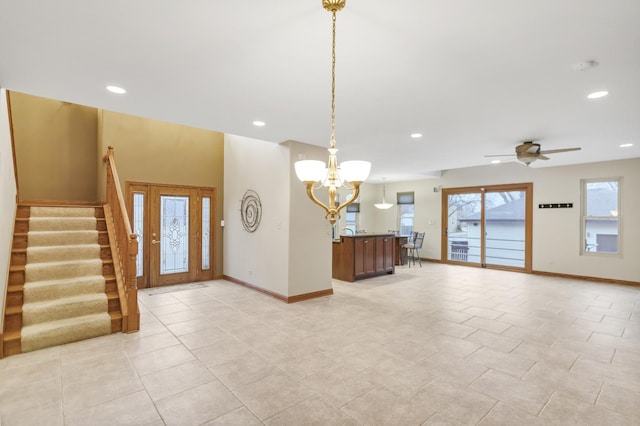 foyer with stairs, light tile patterned floors, recessed lighting, baseboards, and ceiling fan with notable chandelier