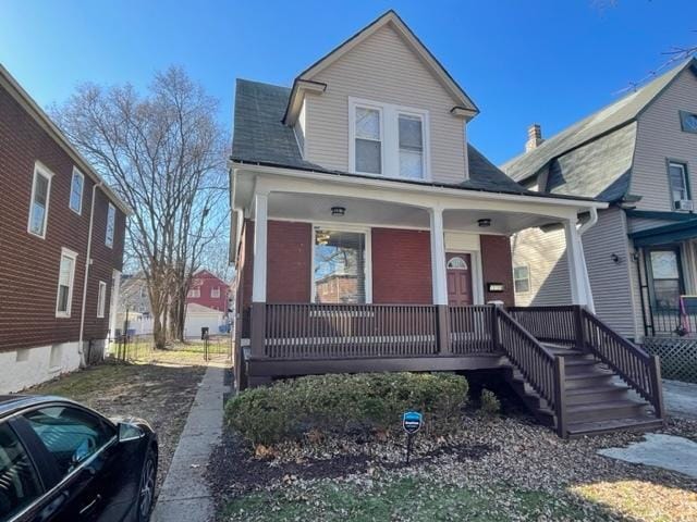 12120 S Parnell Ave, Chicago, IL 60628 - view of front of property with covered porch and a shingled roof