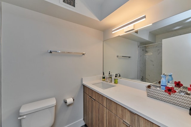 full bath with a marble finish shower, visible vents, vanity, and toilet