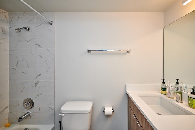 bathroom with toilet, vanity, and bathing tub / shower combination