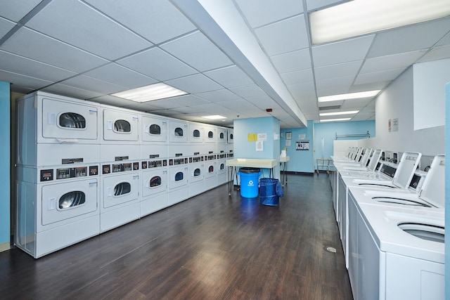 community laundry room featuring dark wood-style floors, stacked washer / dryer, and separate washer and dryer