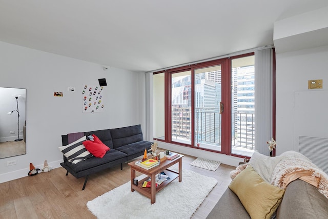 living room with light wood-style floors and baseboards