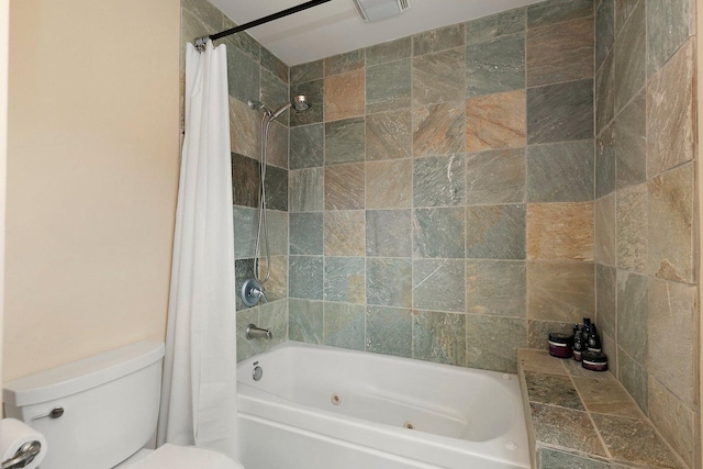 bathroom featuring shower / bath combo with shower curtain and toilet