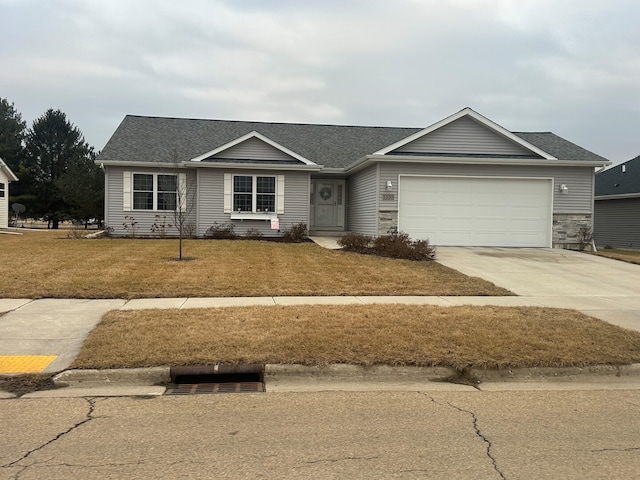 single story home with a garage, driveway, a front lawn, and roof with shingles