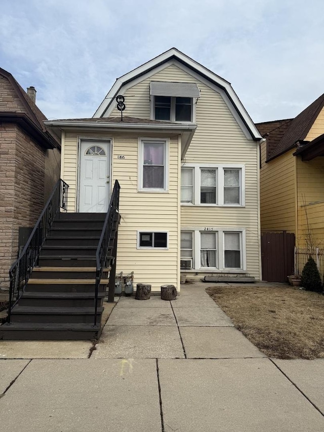 2415 S 50th Ave, Cicero, IL 60804 - dutch colonial with a gambrel roof and fence