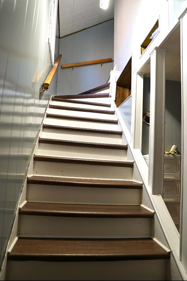 stairs featuring lofted ceiling