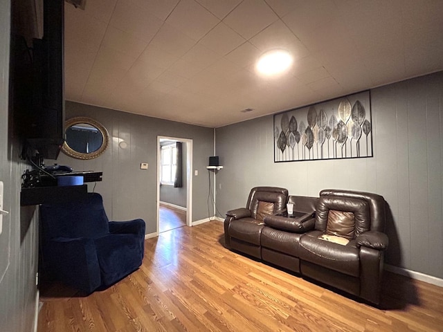 living area featuring wood finished floors and baseboards