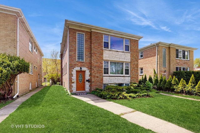 1222 Austin St, Evanston, IL 60202 - view of front facade with a front yard and brick siding