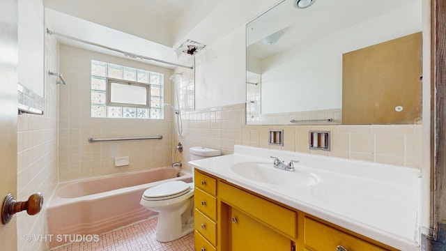 1222 Austin St, Evanston, IL 60202 - bathroom with tile walls, tub / shower combination, toilet, tile patterned flooring, and vanity