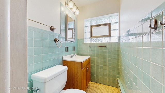 1222 Austin St, Evanston, IL 60202 - half bathroom featuring tile walls, toilet, tile patterned flooring, wainscoting, and baseboard heating