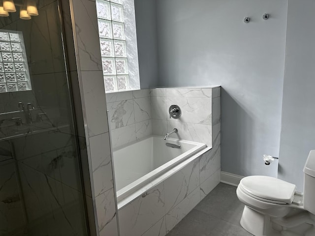 full bath featuring a bath, baseboards, a marble finish shower, tile patterned floors, and toilet