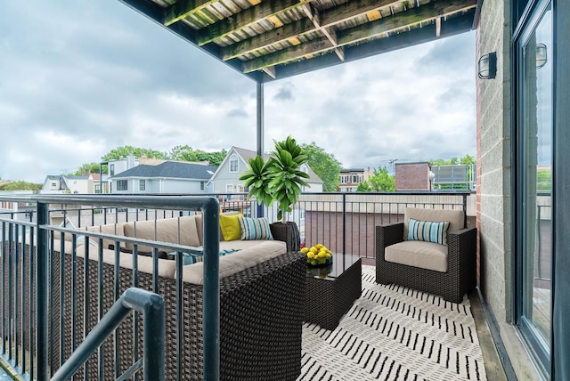 balcony with an outdoor living space and a residential view