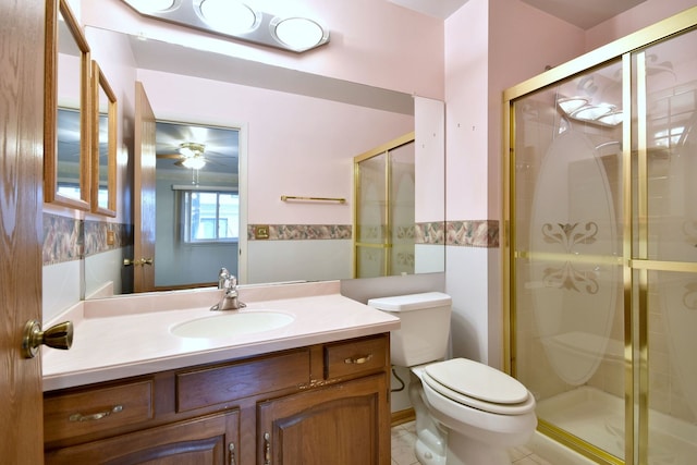 full bath featuring tile patterned floors, a shower stall, toilet, and vanity