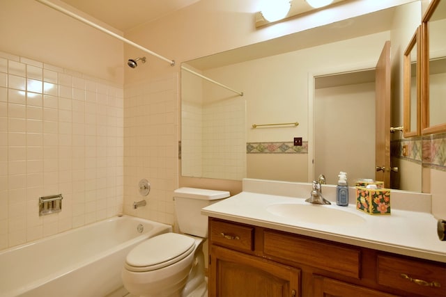 full bathroom with bathing tub / shower combination, vanity, and toilet