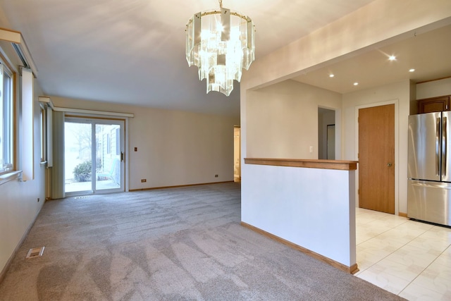 spare room with baseboards, visible vents, light colored carpet, a notable chandelier, and recessed lighting