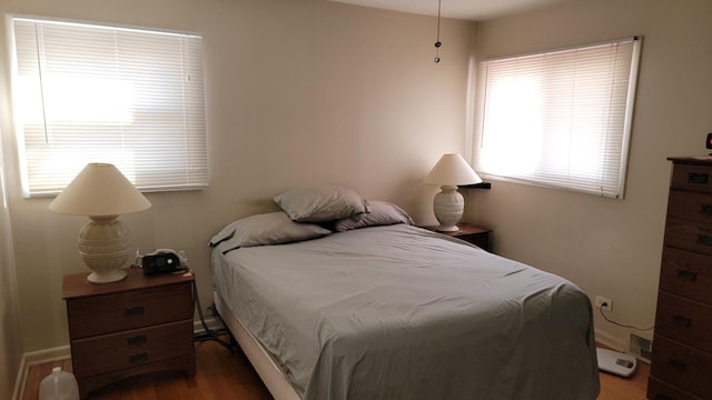 bedroom featuring wood finished floors