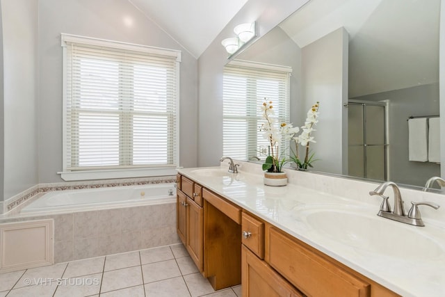 full bath featuring a sink, lofted ceiling, a stall shower, and tile patterned floors