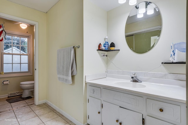 bathroom featuring tile patterned flooring, visible vents, baseboards, and vanity