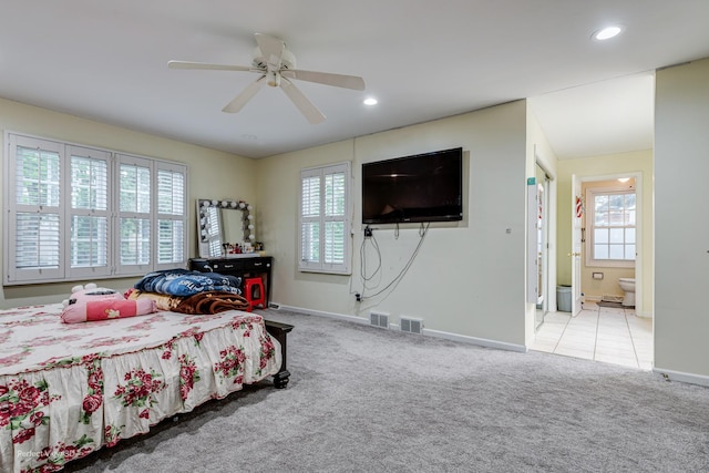 bedroom featuring recessed lighting, multiple windows, and light colored carpet