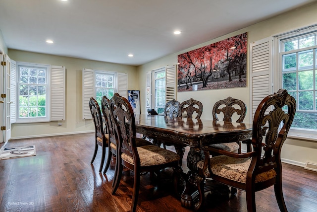 dining area with baseboards, dark wood-type flooring, and recessed lighting