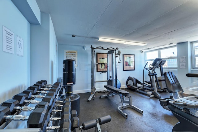 gym featuring baseboards