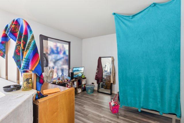 bedroom with wood finished floors