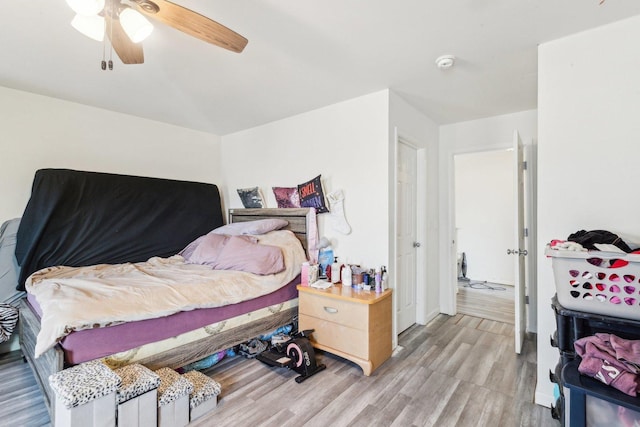 bedroom featuring a ceiling fan and light wood finished floors