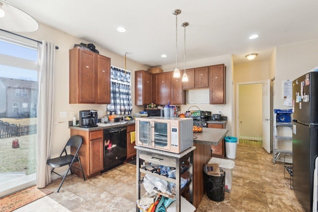 kitchen with black appliances, decorative light fixtures, a center island, recessed lighting, and brown cabinetry