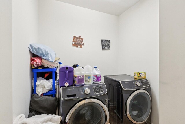 laundry area with laundry area and separate washer and dryer